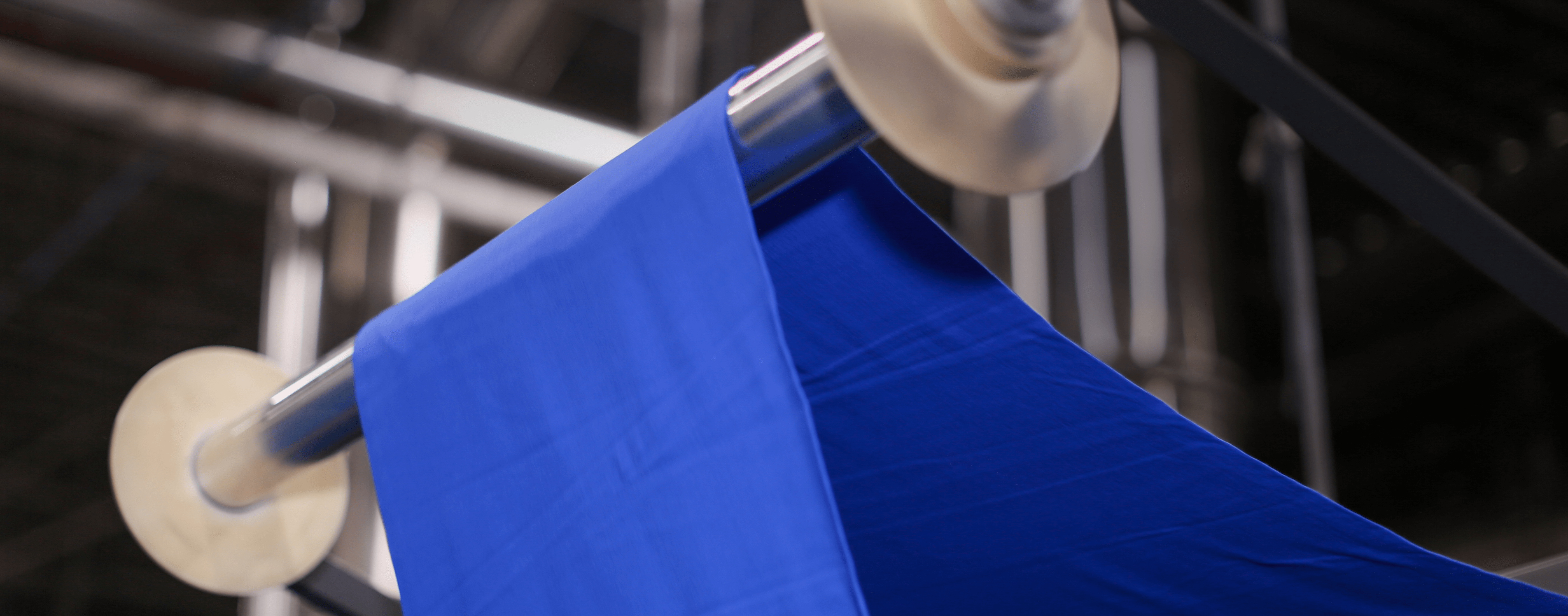 A close up image of Gildan blue fabric in the texitle facility.