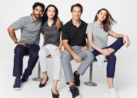 Four people sitting on a bench together