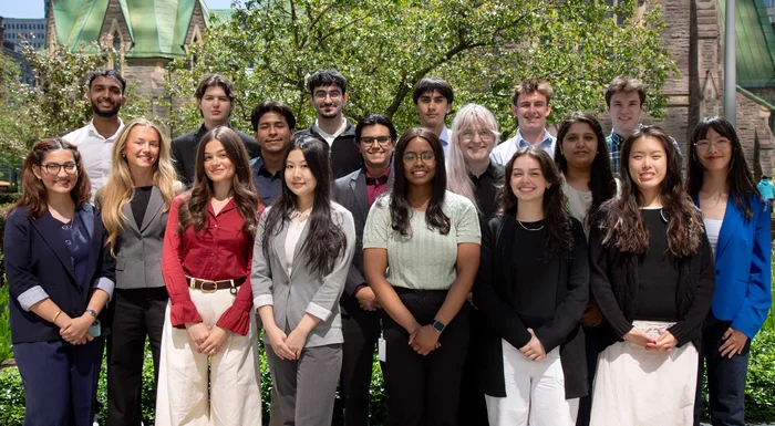 Gildan’s Corporate Head Office interns in Montreal are smiling at the camera while standing outside.