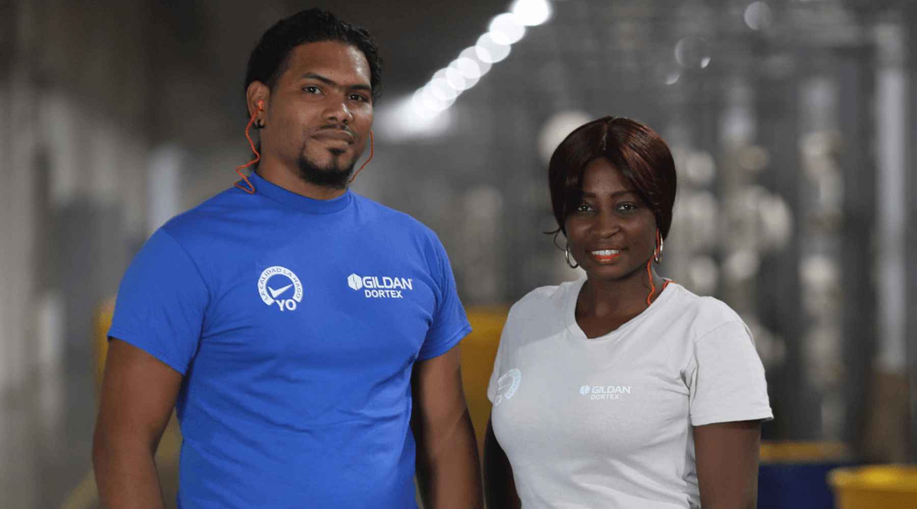 A woman and a man in Dominican Republic are smiling at the camera.