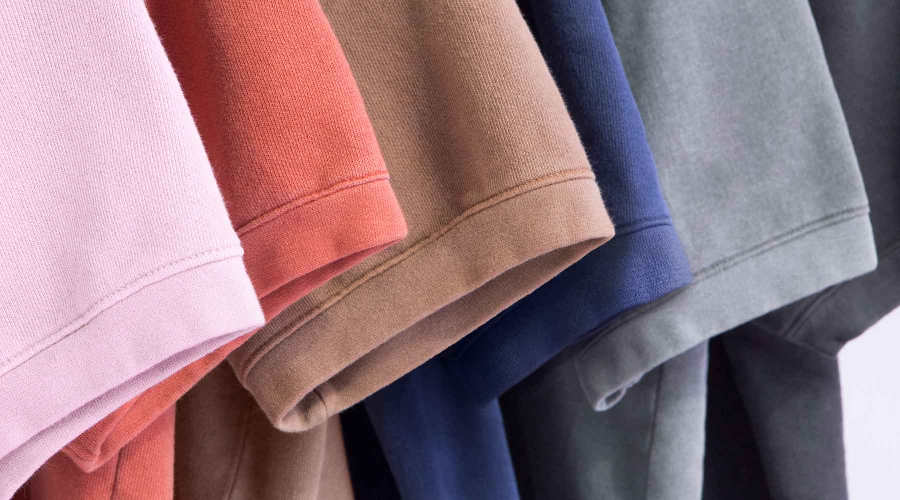 A close-up of various colored American Apparel™ t-shirt sleeves.