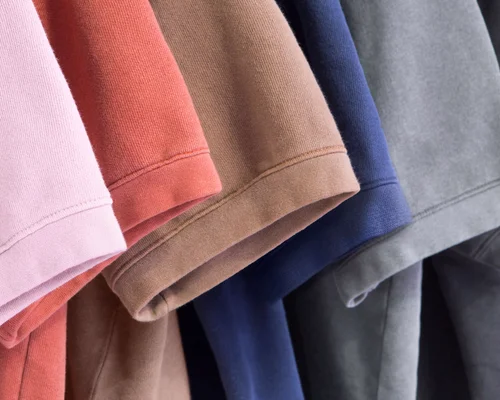 A close-up of various colored American Apparel™ t-shirt sleeves.