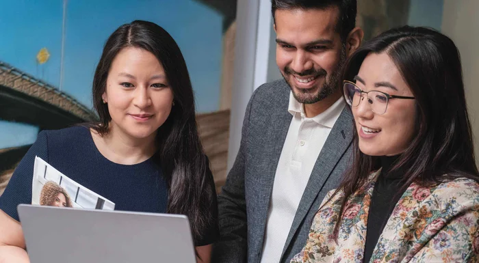 Three employees from our Honduras manufacturing headquarters are collaborating.